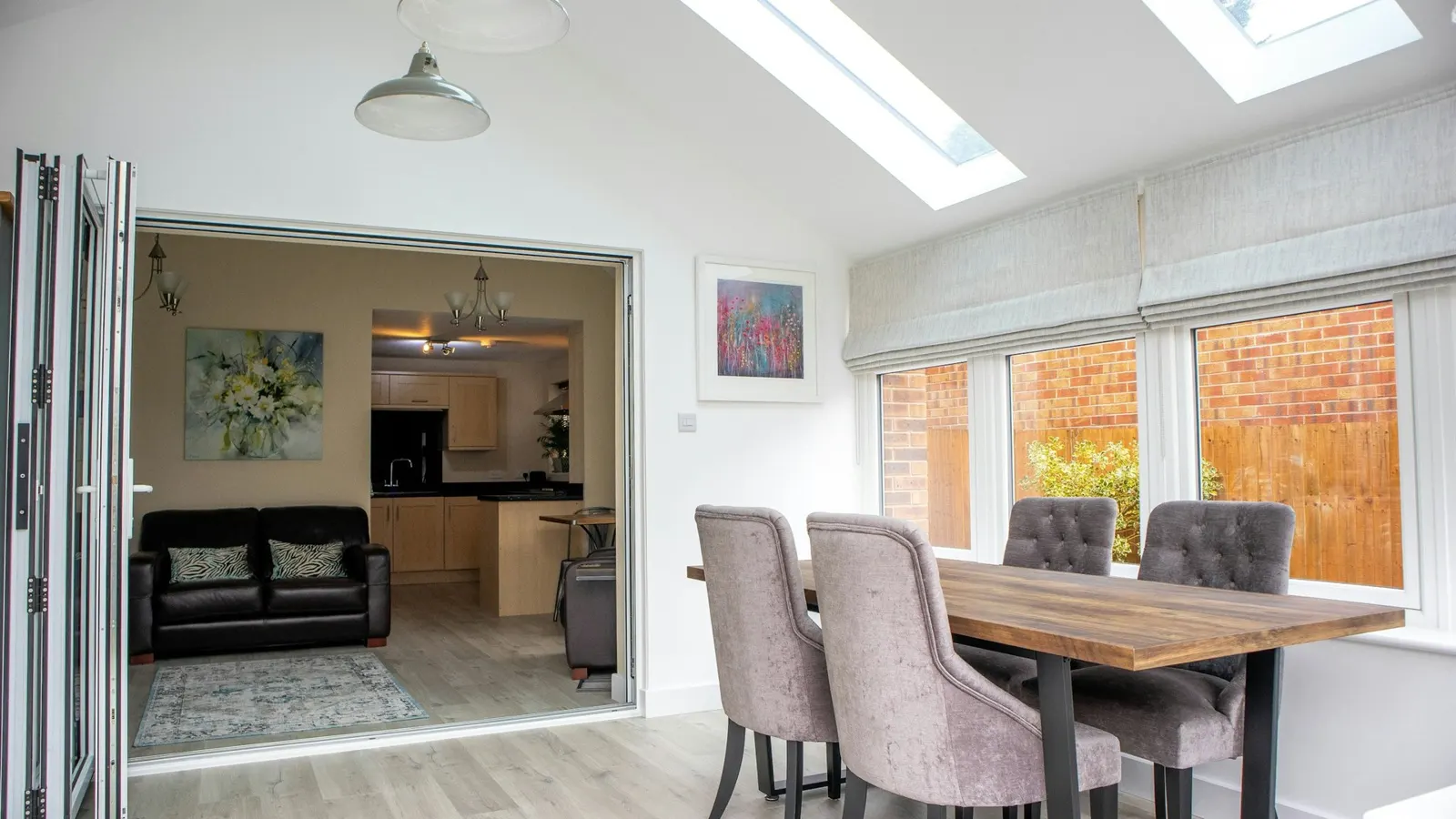 Kitchen-diner extension interior with bi-fold doors and roof lights flooding the room with light