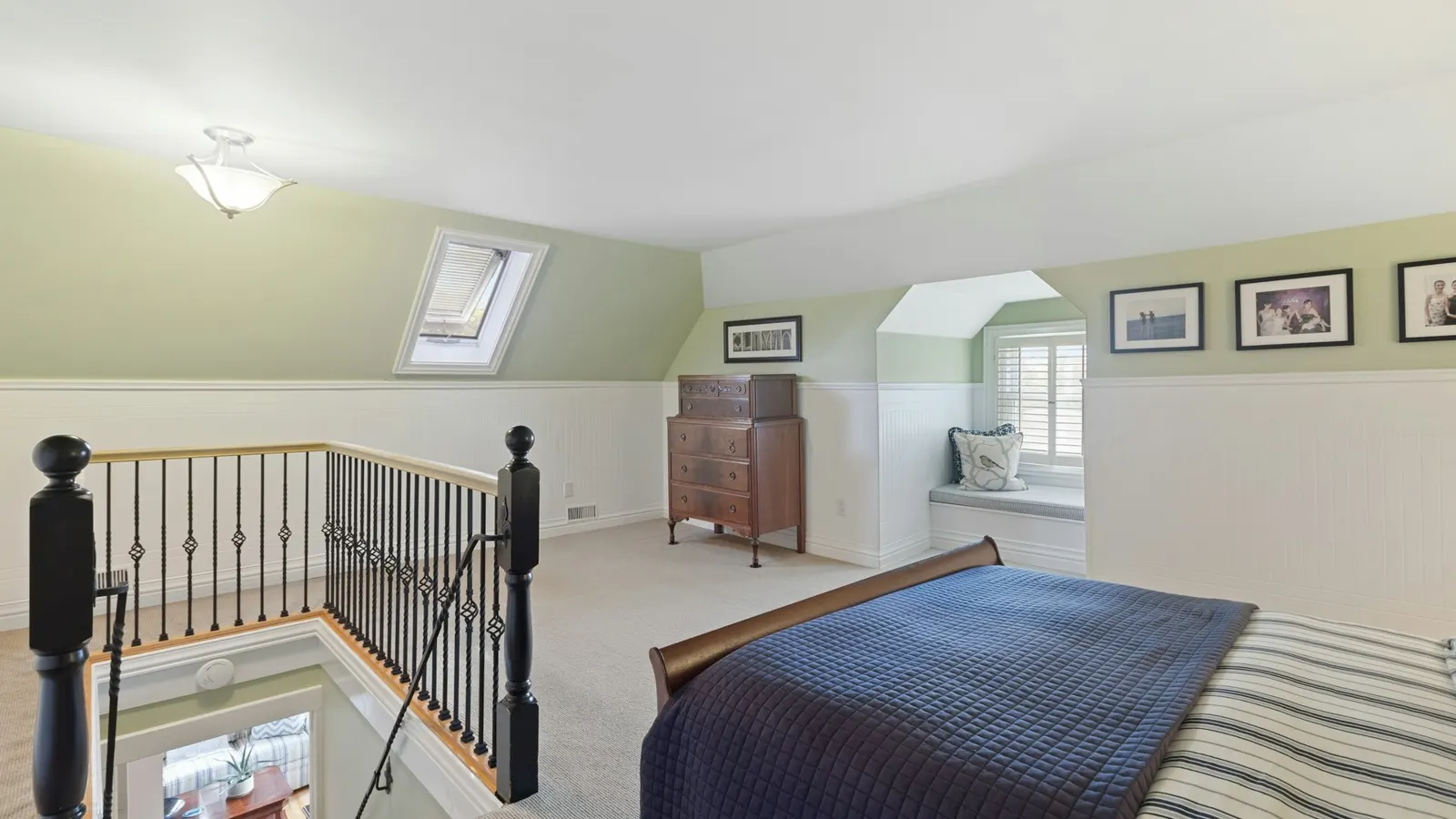 Spacious loft conversion bedroom with roof windows and a new staircase balustrade